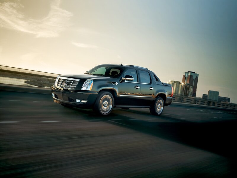 Black Cadillac truck on highway
