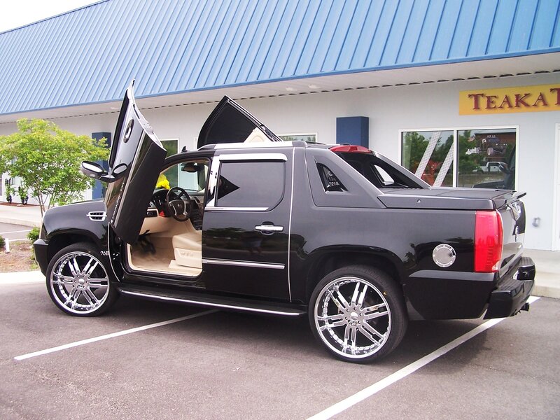 black cadillac truck with gull-wing doors