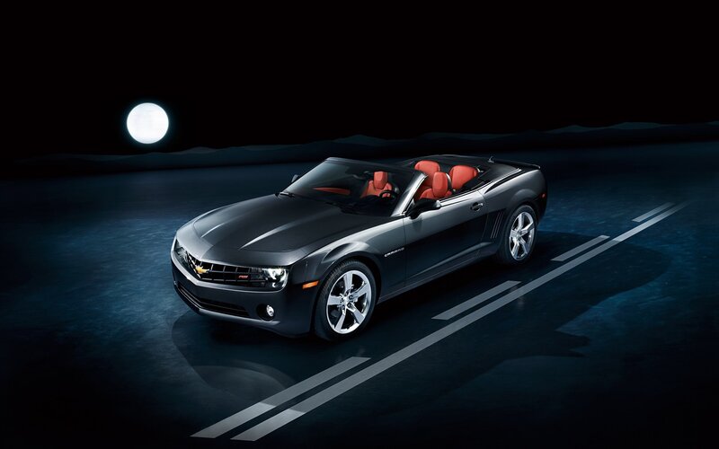 Black Camaro convertible at night