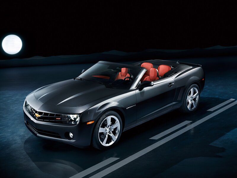Black Camaro convertible at night