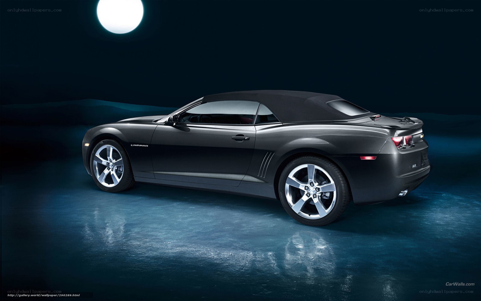 Black Camaro convertible at night