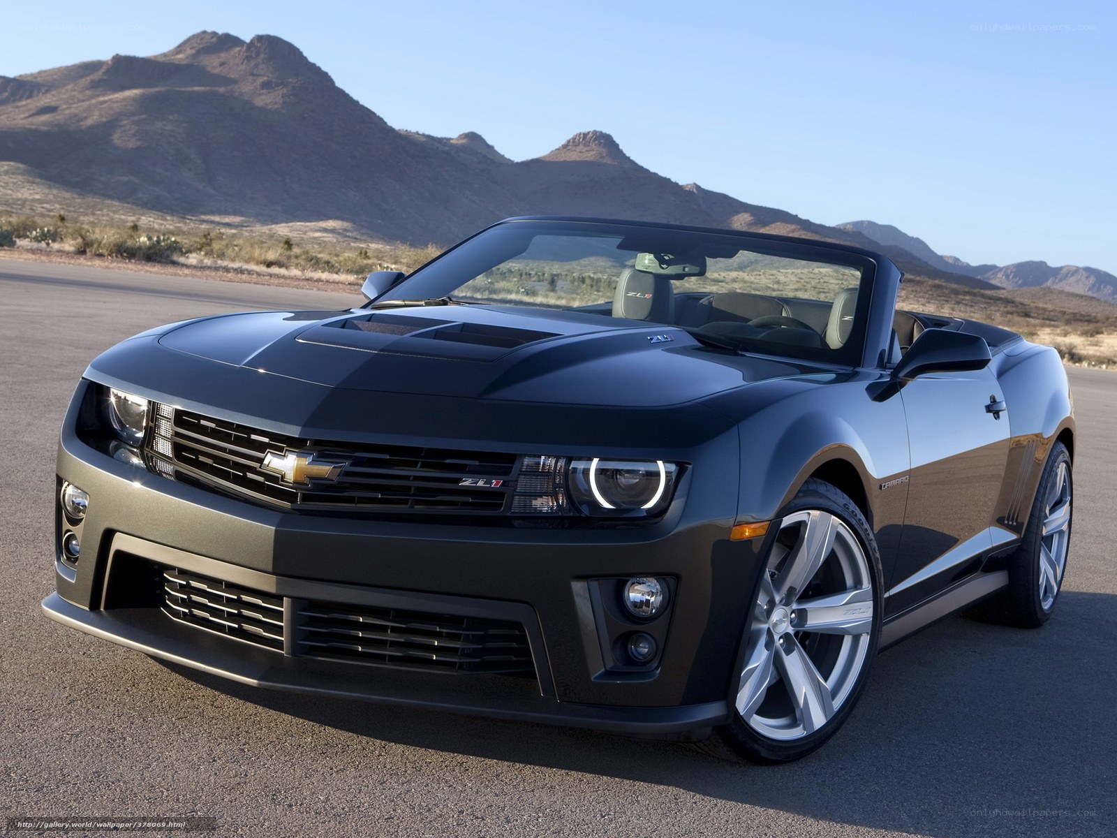 Black Camaro convertible in desert