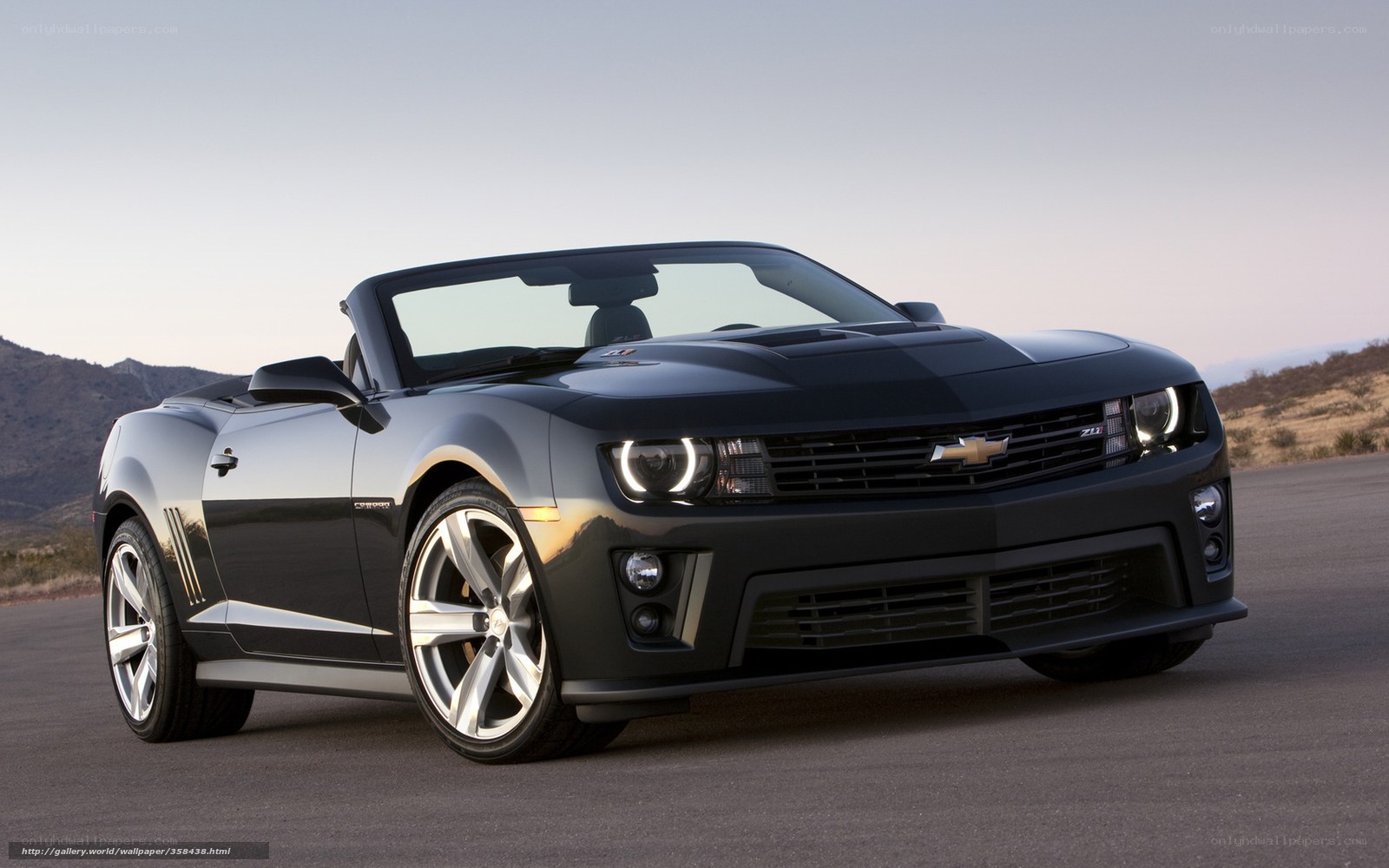 Black Camaro convertible on road