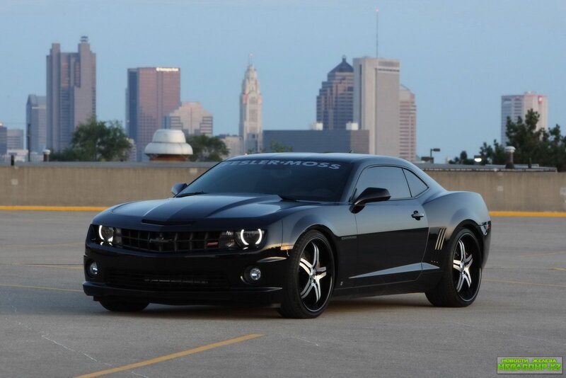 Black Camaro in city parking lot