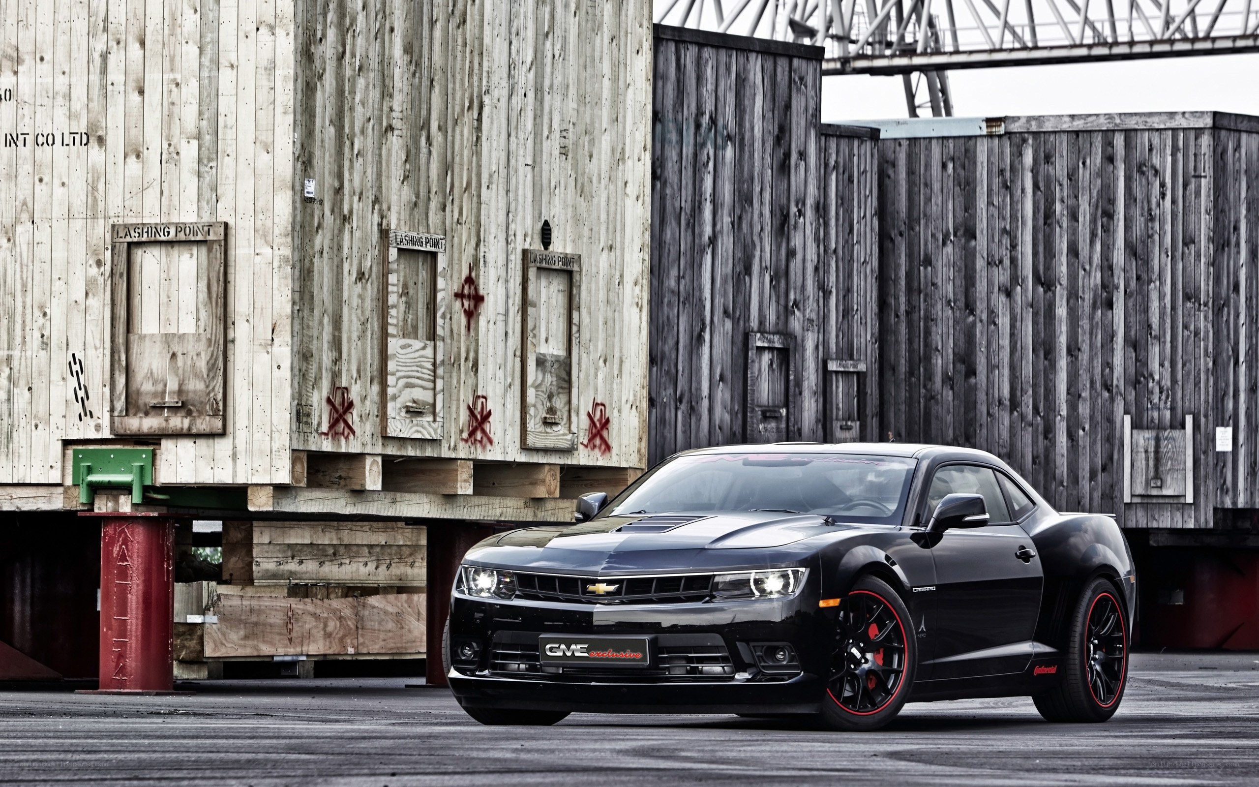 Black Camaro in industrial setting