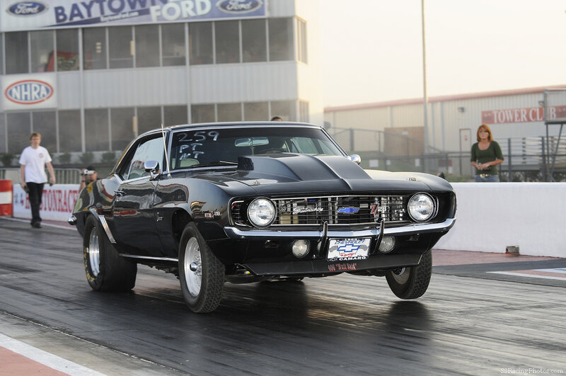 Black Camaro on a drag strip