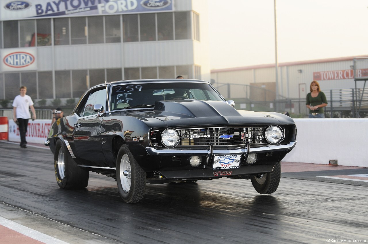 Black Camaro on a drag strip