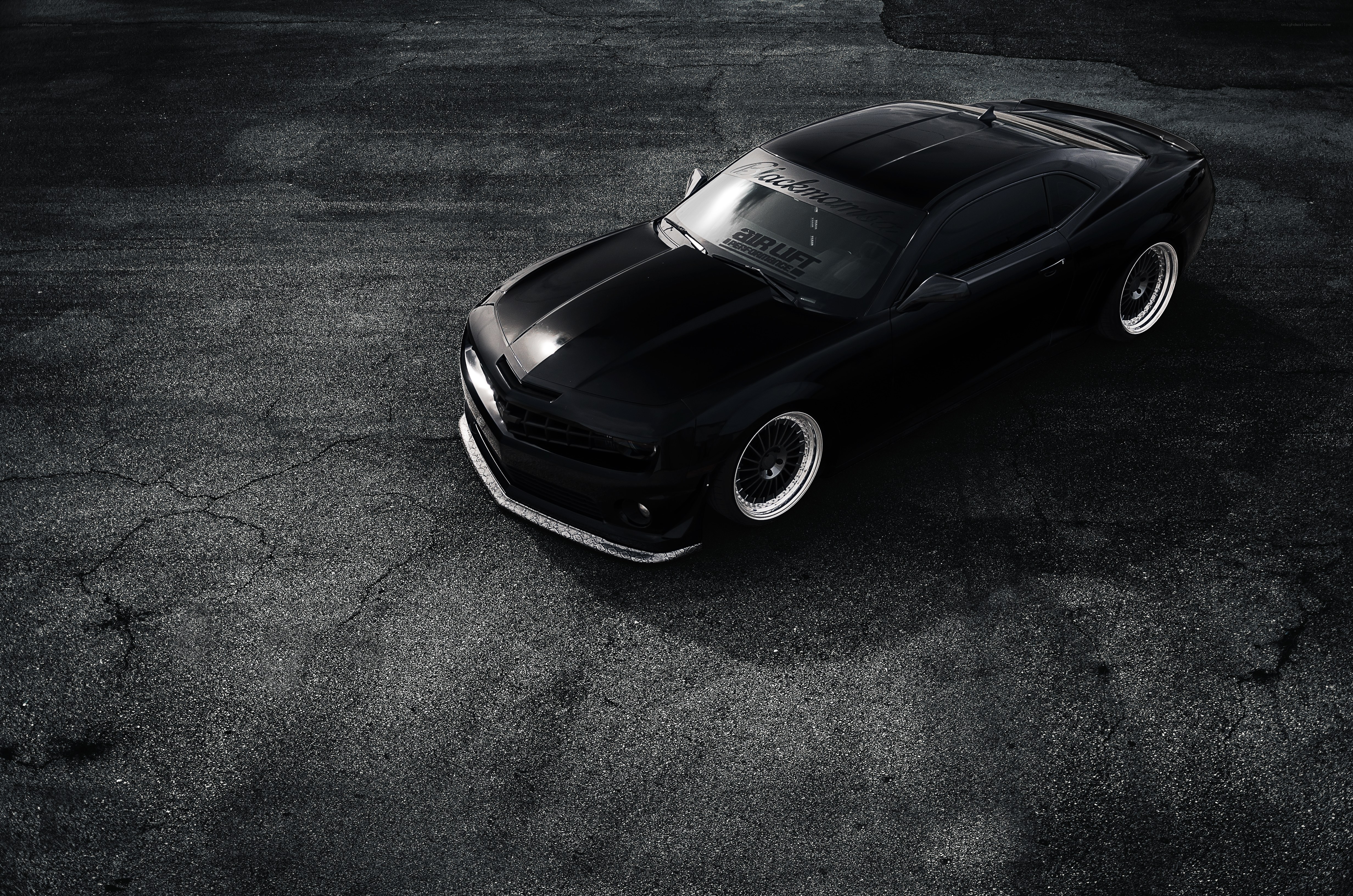 black camaro on asphalt