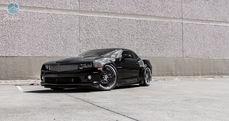 Black Camaro on concrete
