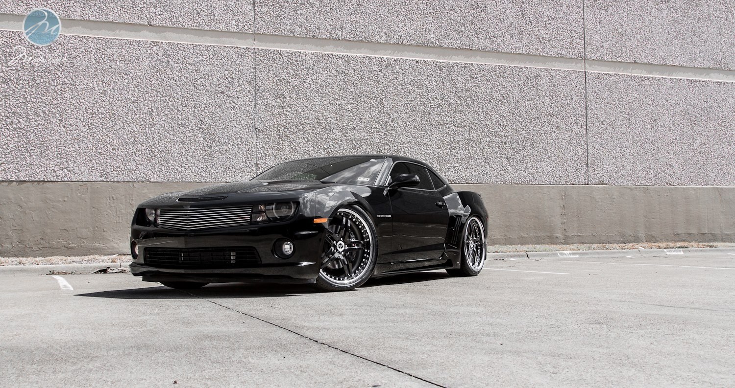Black Camaro on concrete