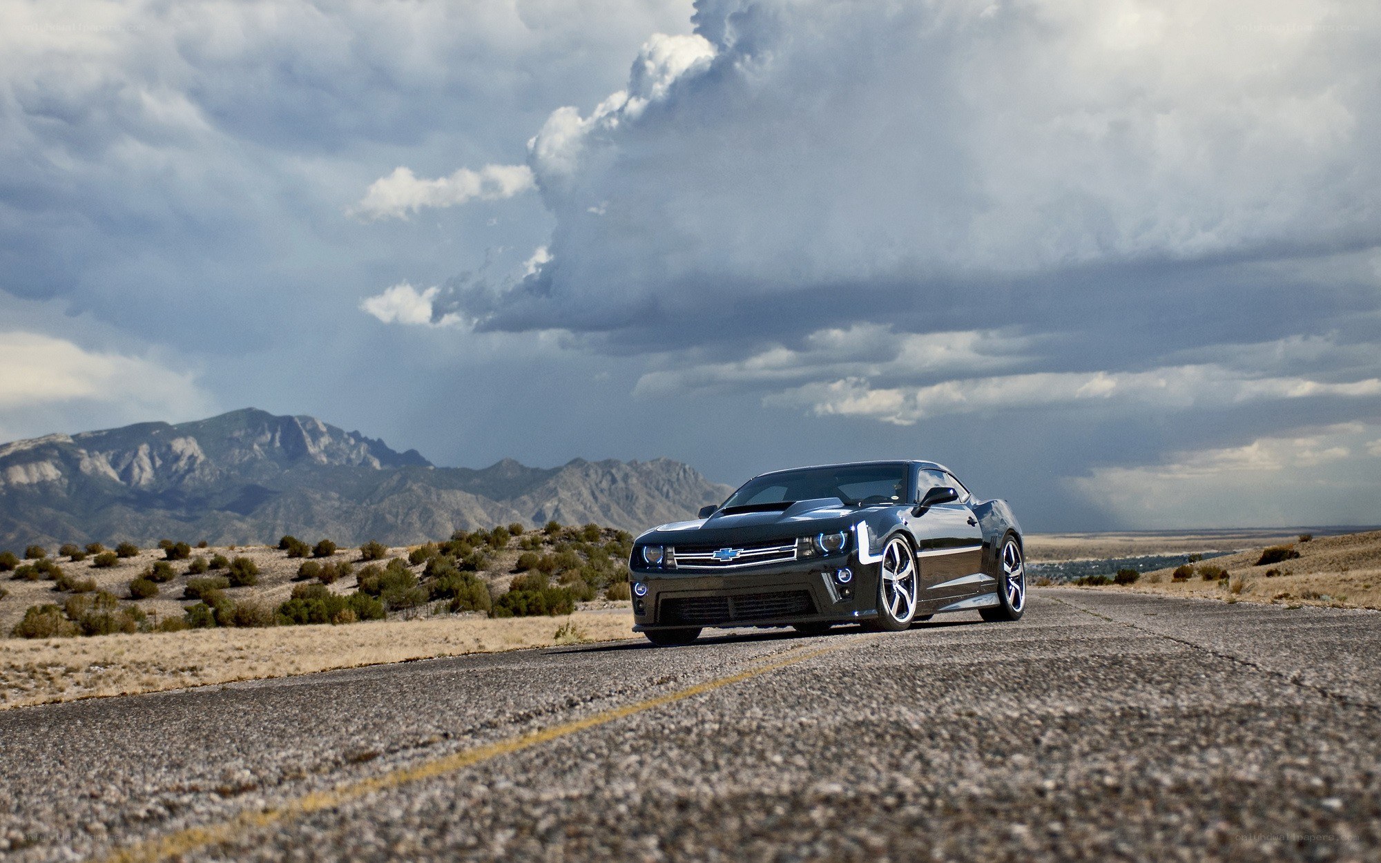 Black Camaro on desert road