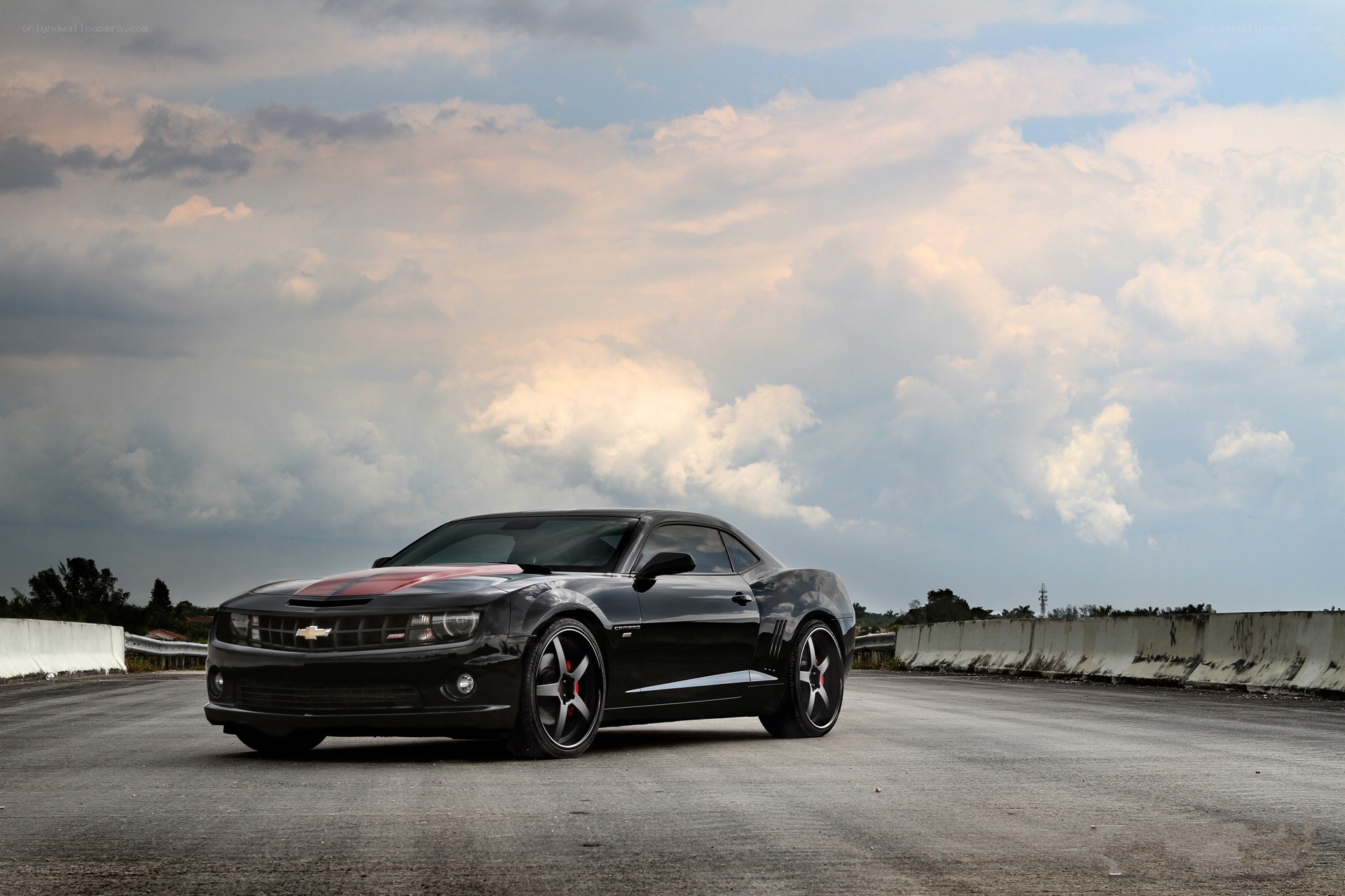 Black Camaro on empty road