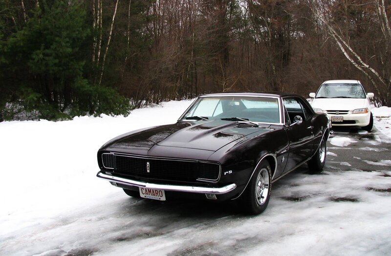 Black Camaro on snowy road