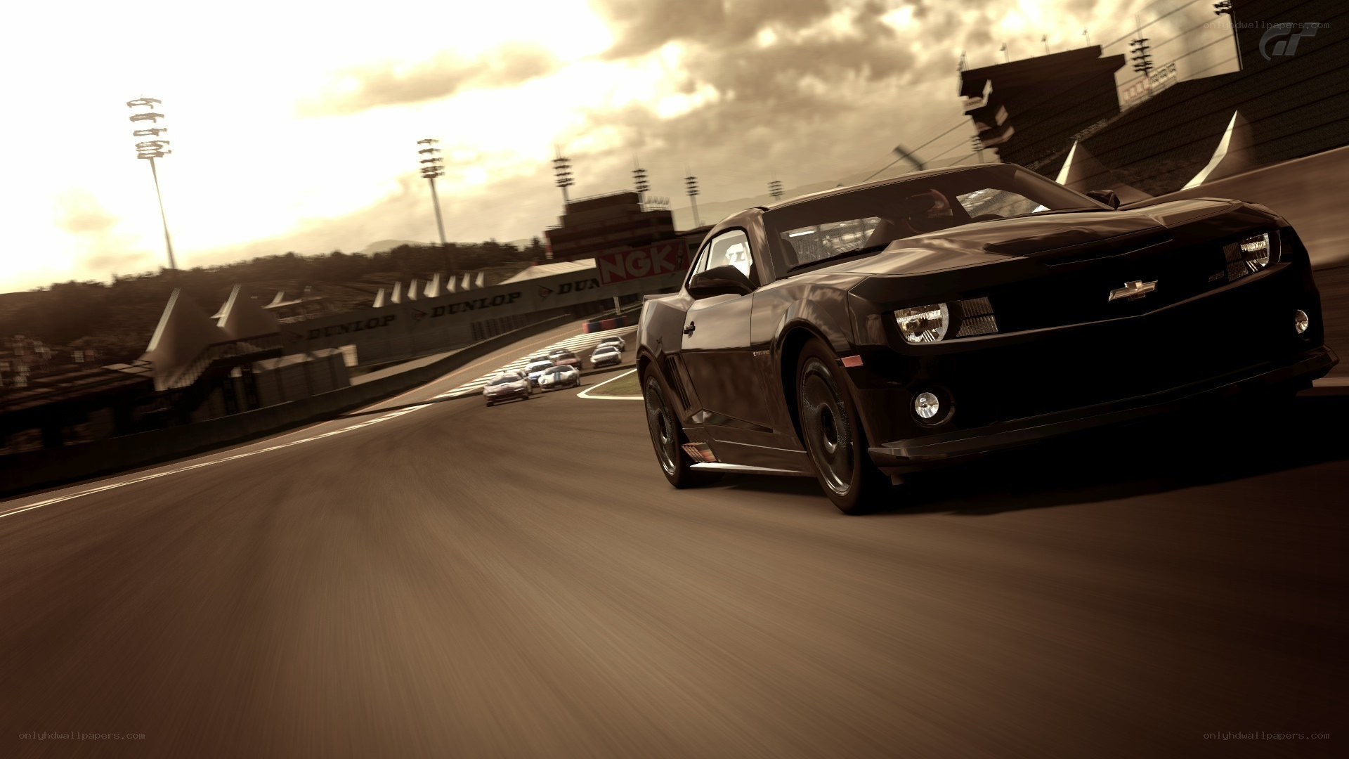 Black Camaro racing on track