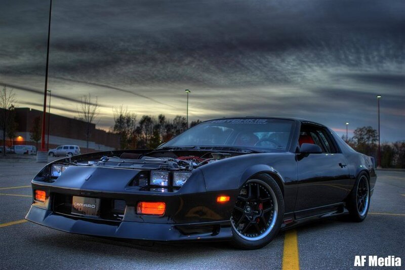 Black Camaro with open hood
