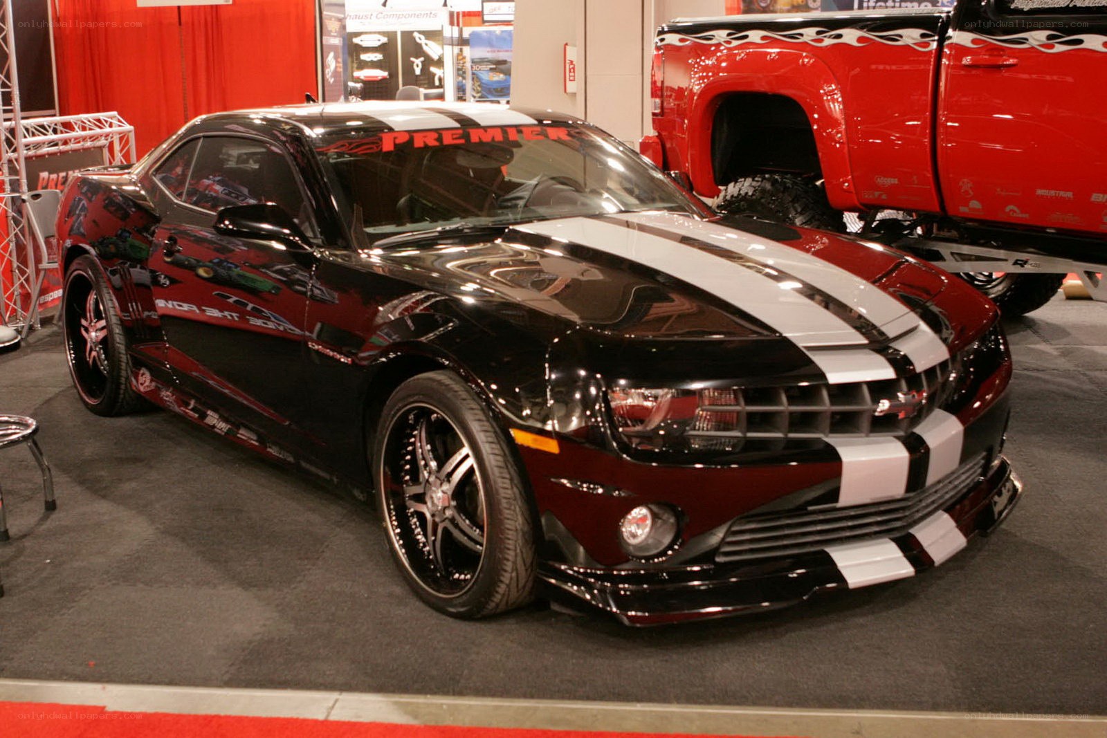 black camaro with racing stripes