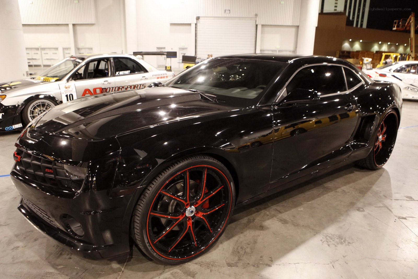Black Camaro with red wheels