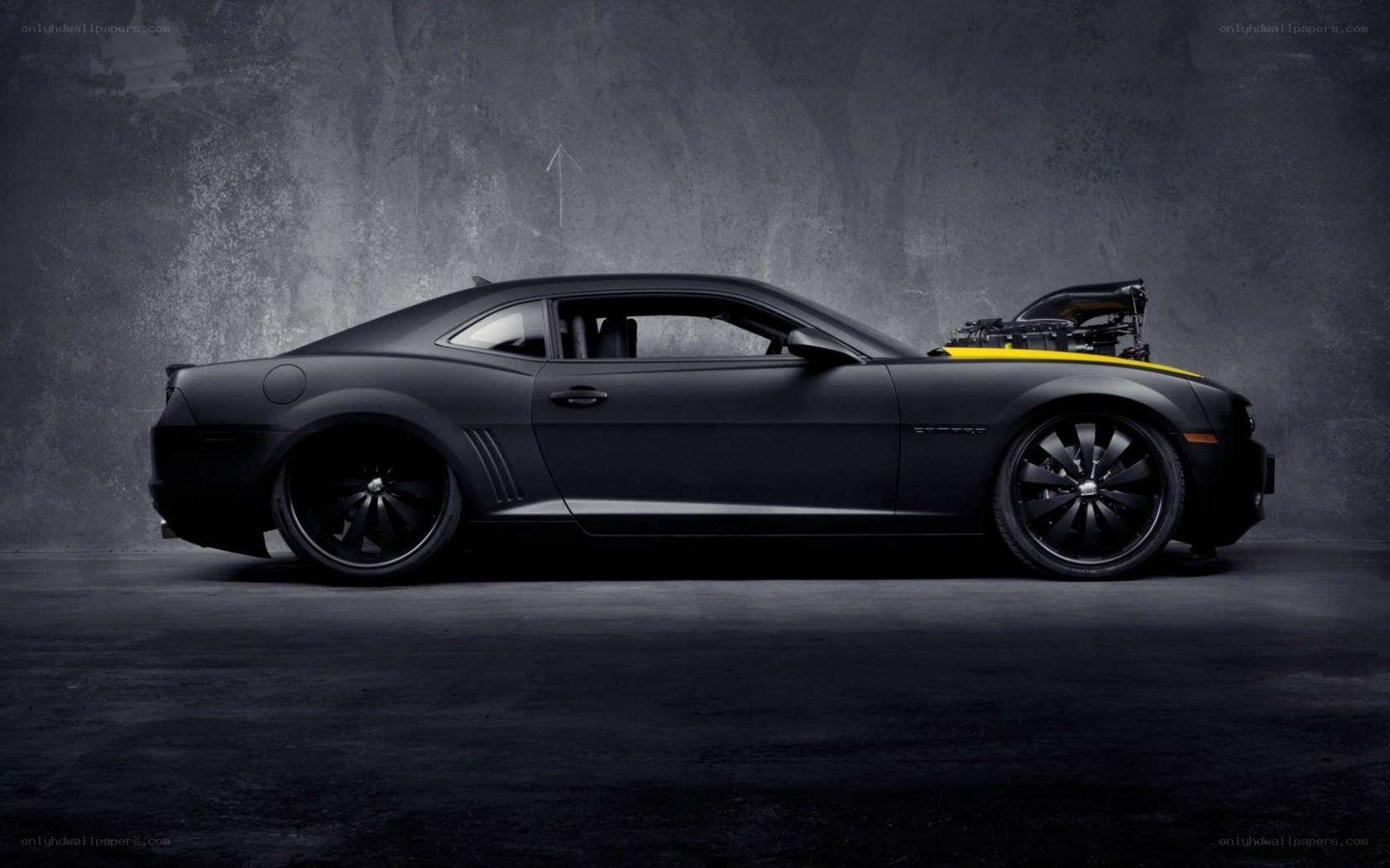 black camaro with yellow stripe