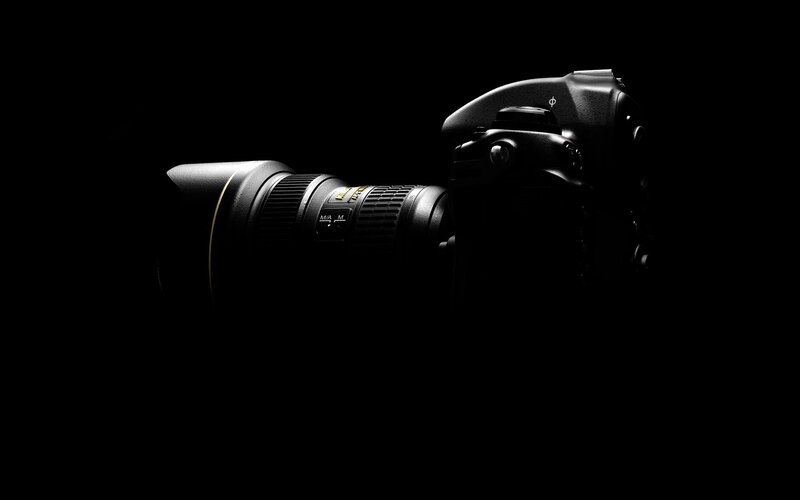 Black Camera on Black Background — Dramatic