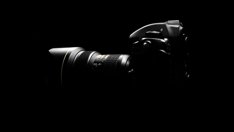 Black Camera on Dark Background