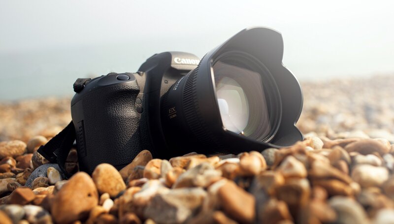 Black Camera on Pebbles