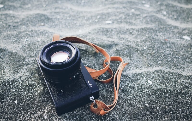 Black Camera on Sand