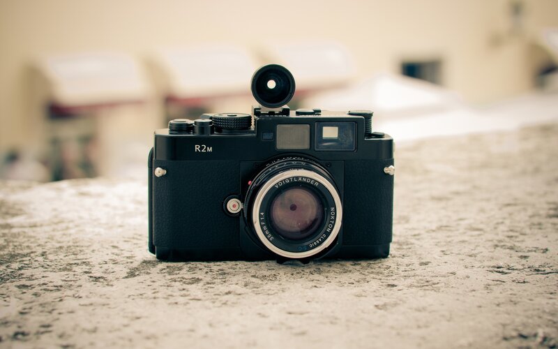 black camera on stone surface