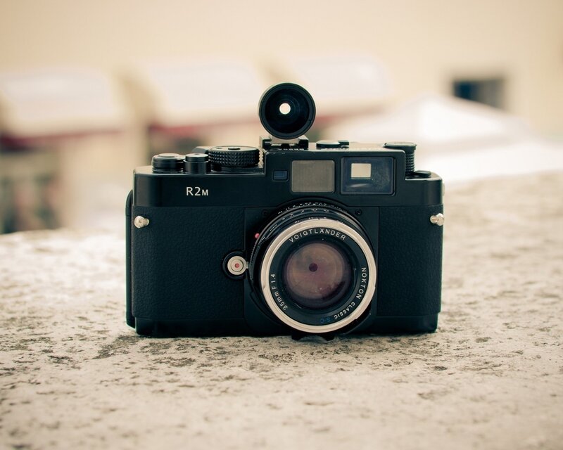 Black camera on stone surface