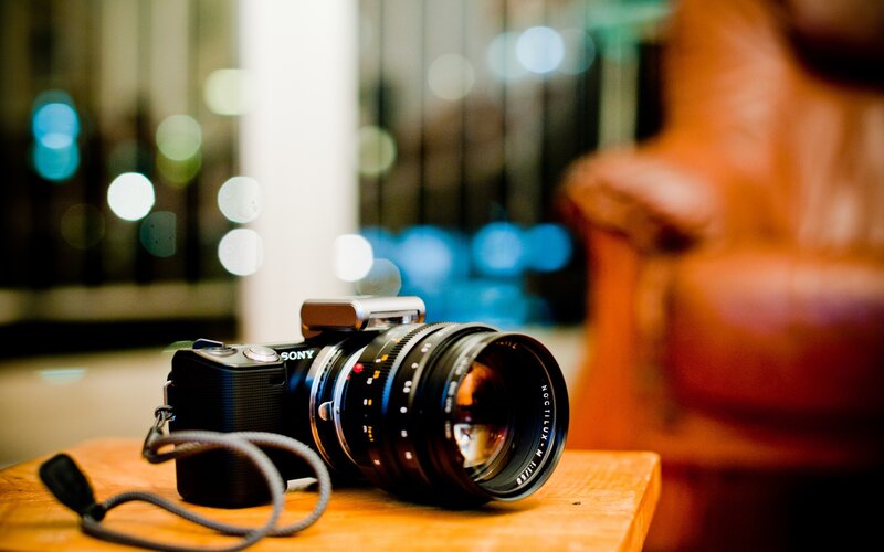 Black Camera on Table — Brown