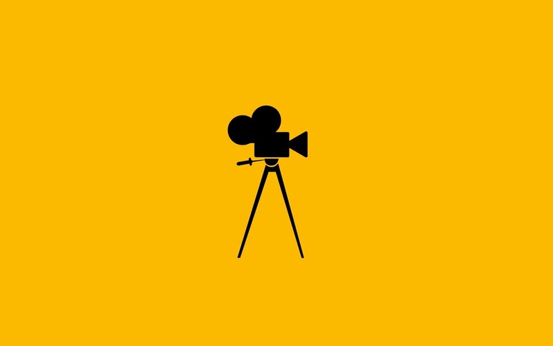 black camera on yellow