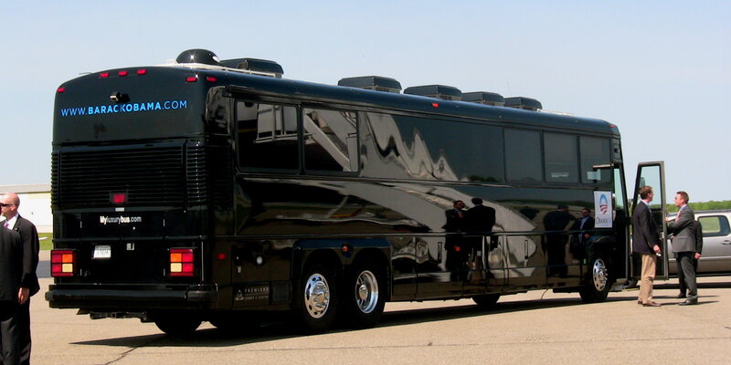 Black campaign bus with Obama branding