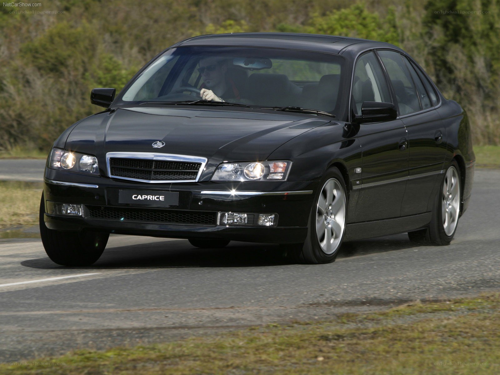 black caprice sedan on road
