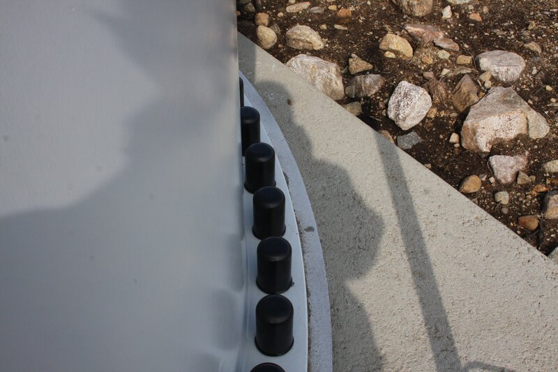 black caps on concrete structure