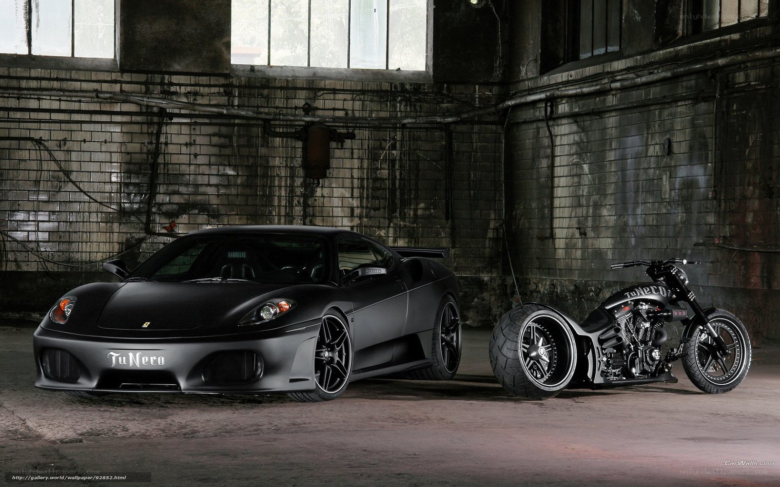 Black car and motorcycle in warehouse