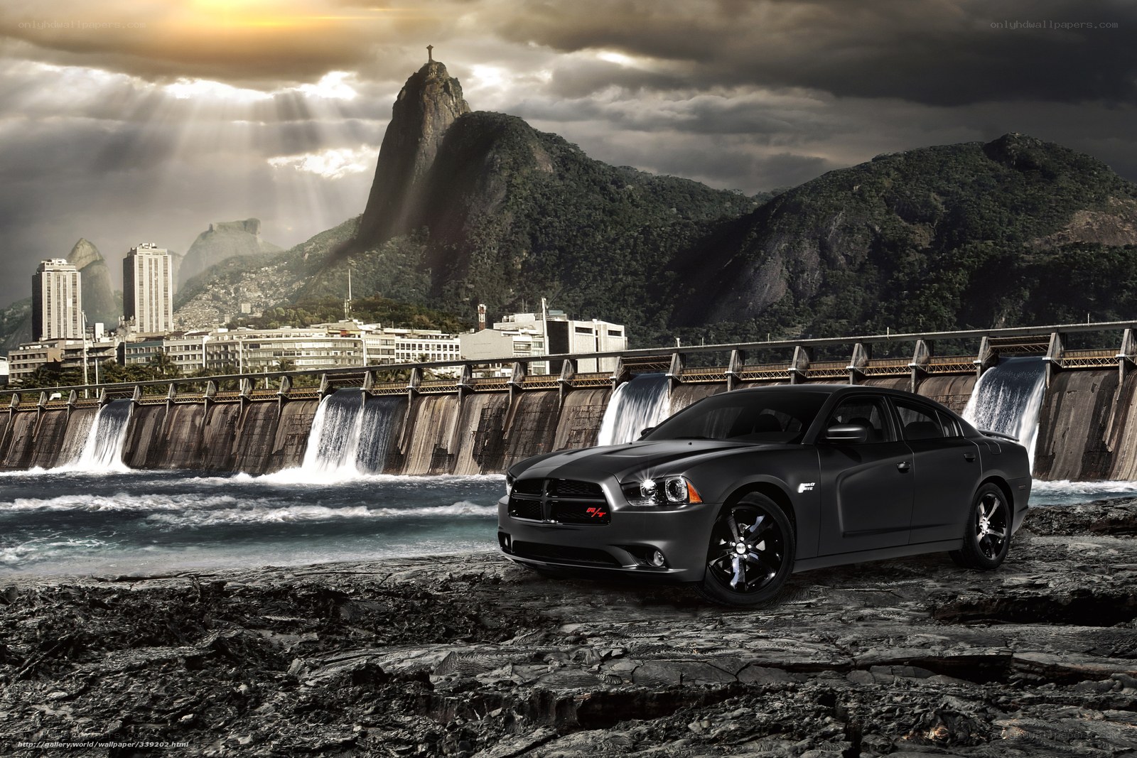 Black car at dam with mountain