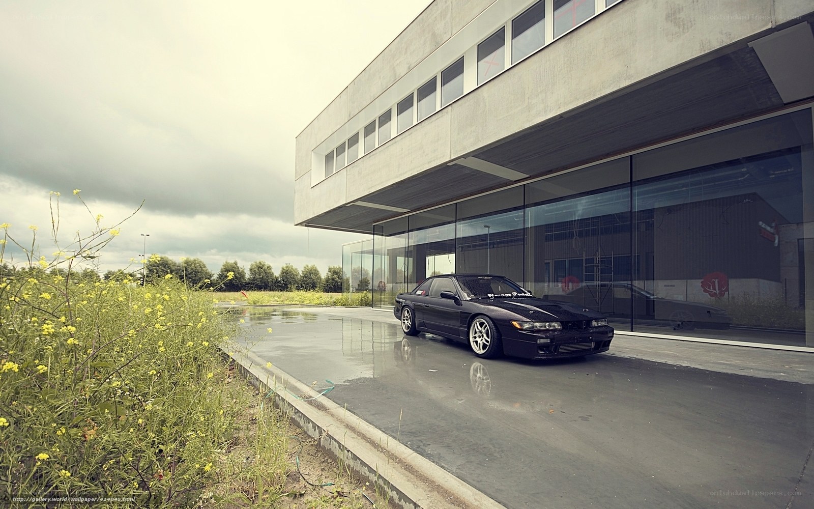 Black car at modern building