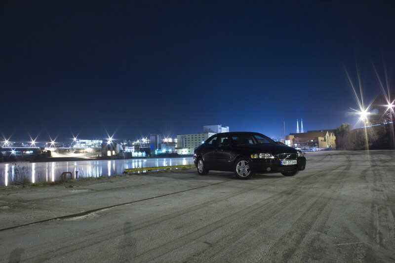 Black car at night by the water