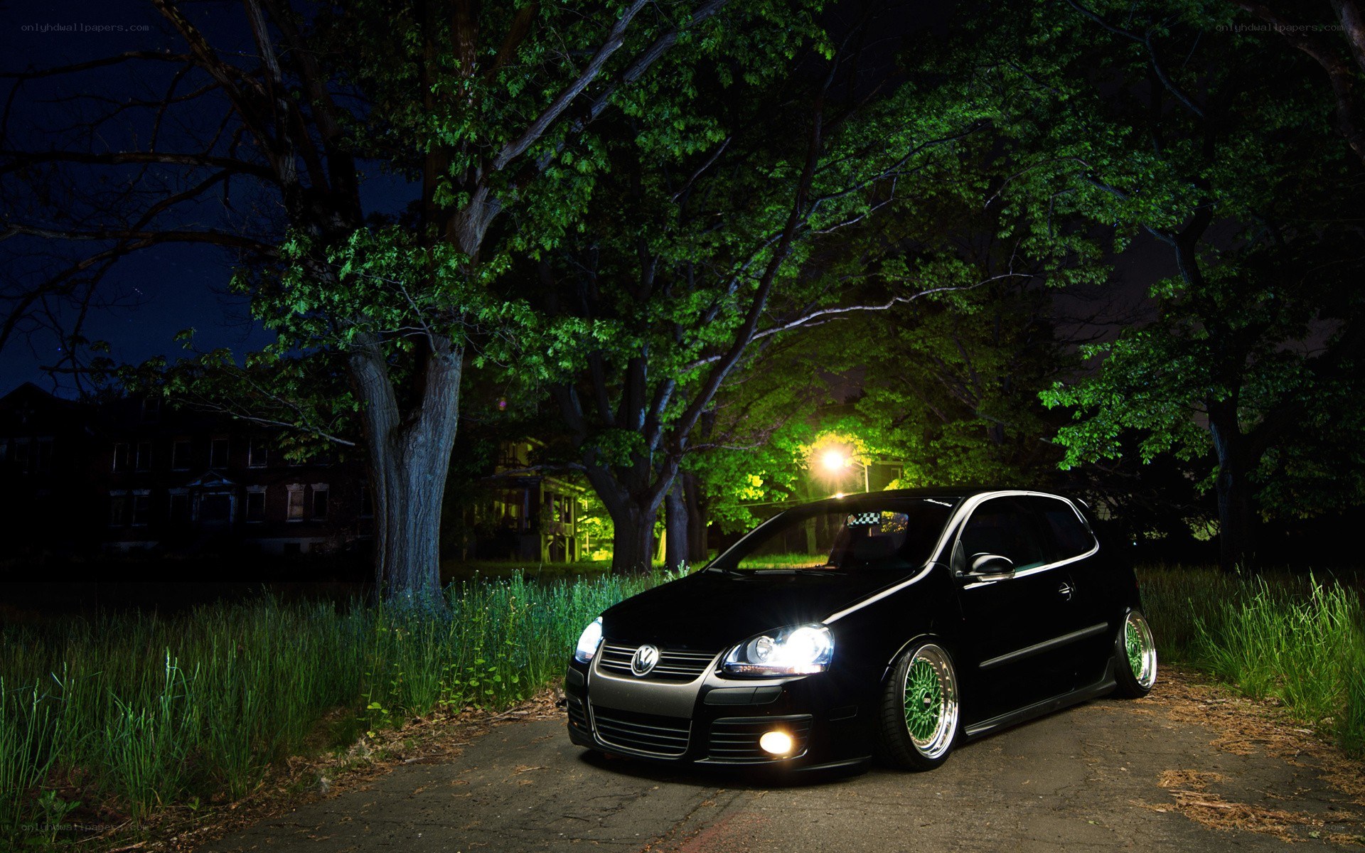 Black car at night in a park