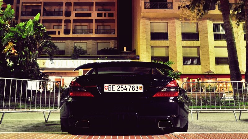 Black car at night in city