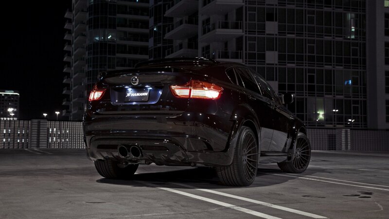black car at night in parking lot