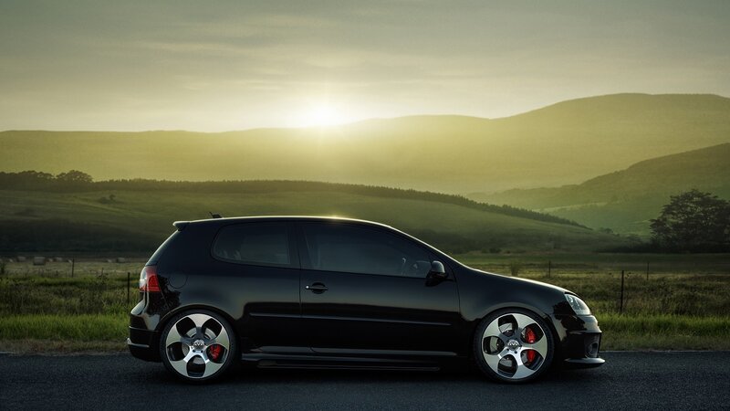Black car at sunset in the countryside
