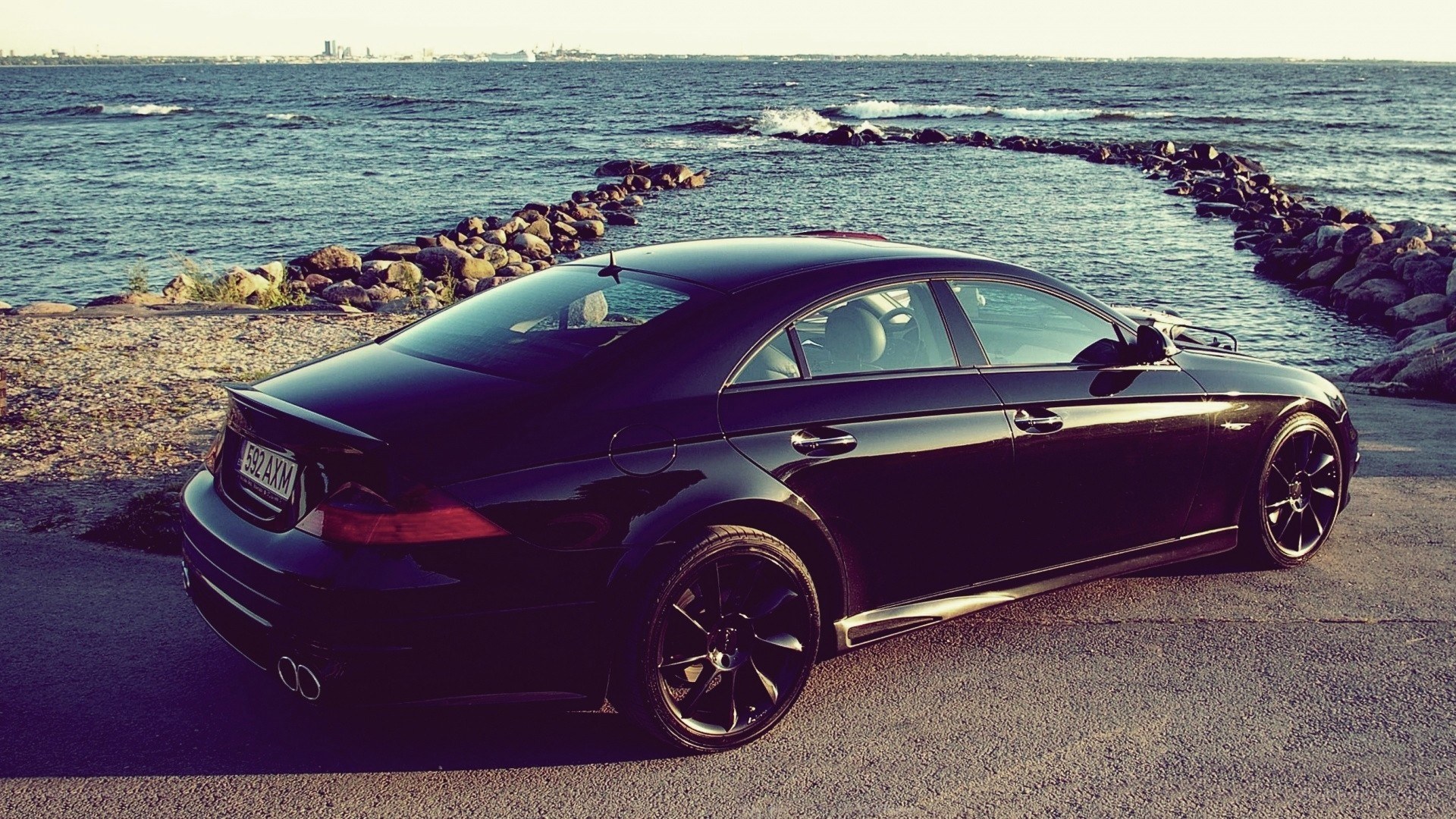 Black car by the sea