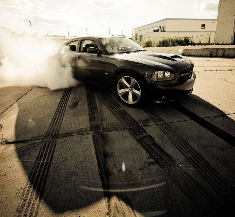 Black car doing burnout