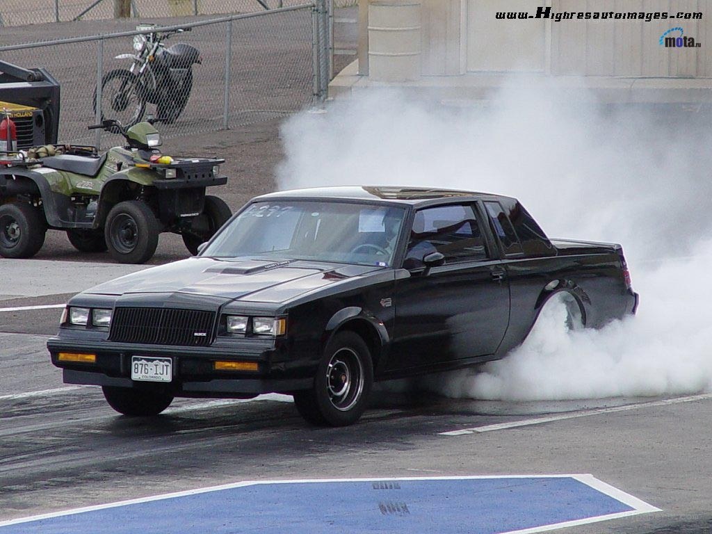 Black car doing burnout