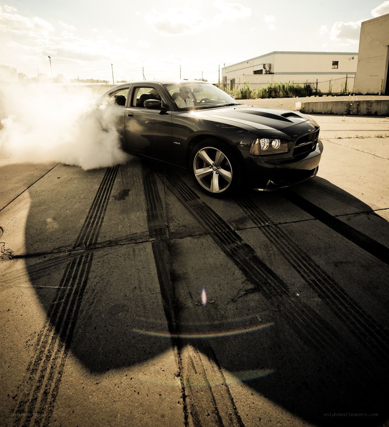 Black car doing burnout