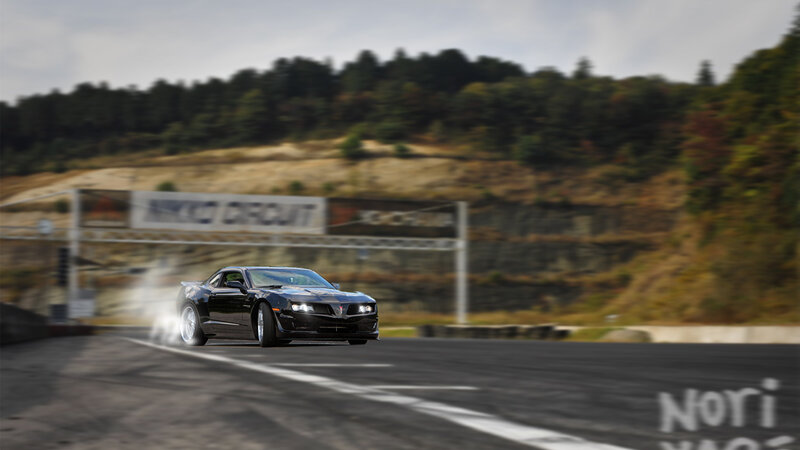 Black car drifting at circuit