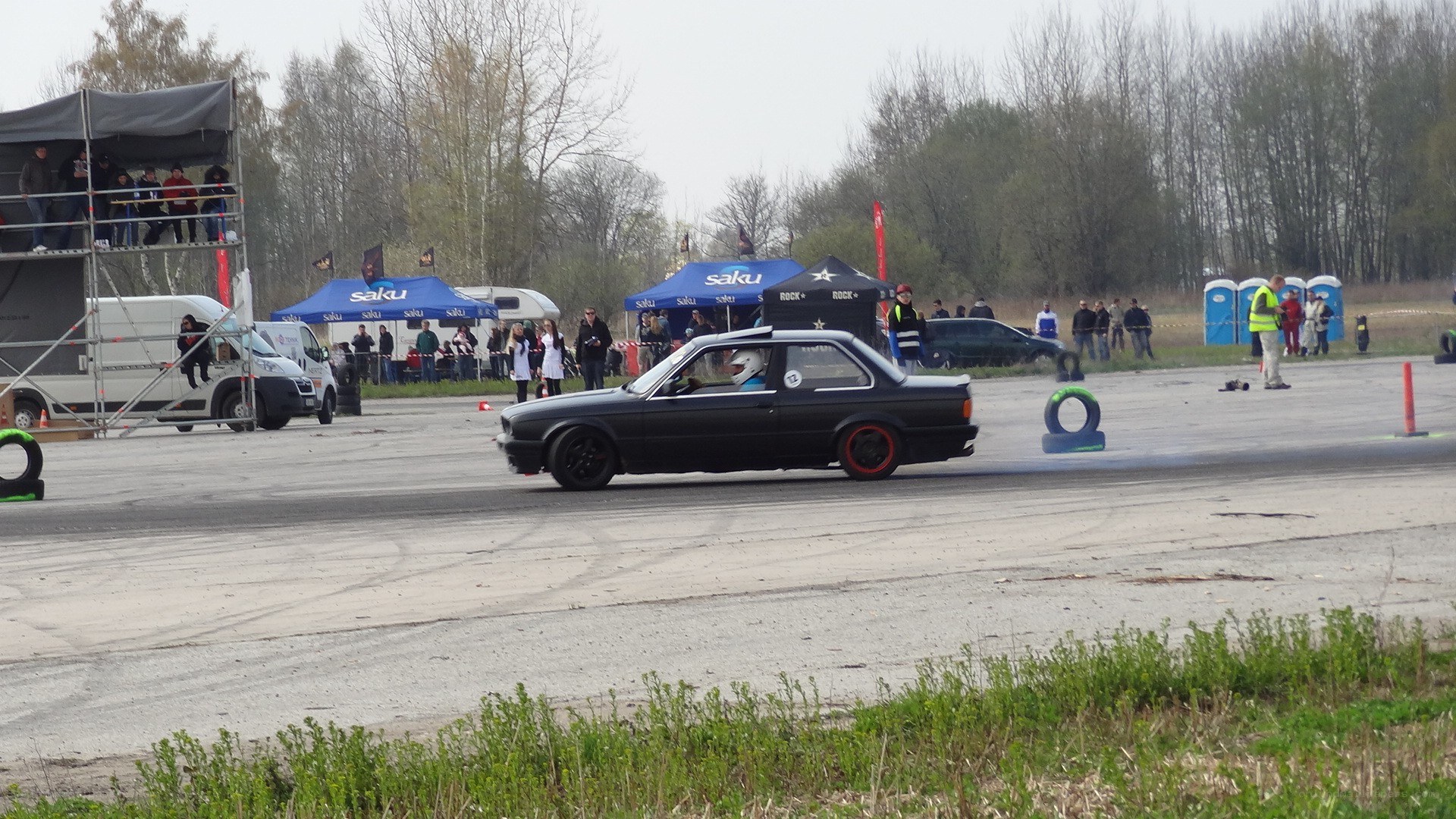 Black car drifting at event