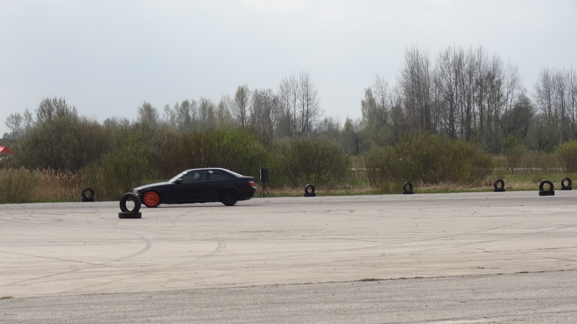 Black car drifting on track