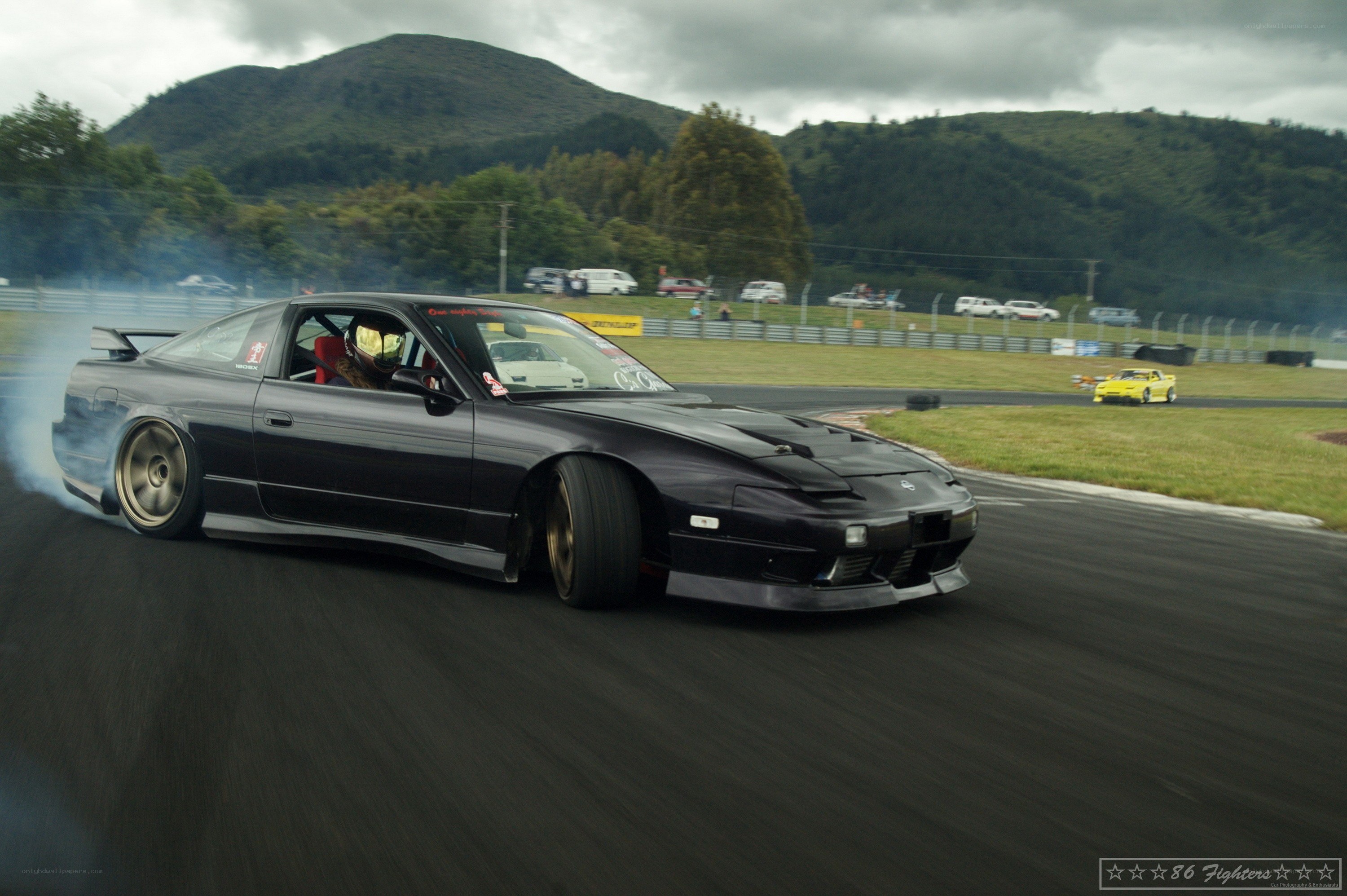 Black car drifting on track