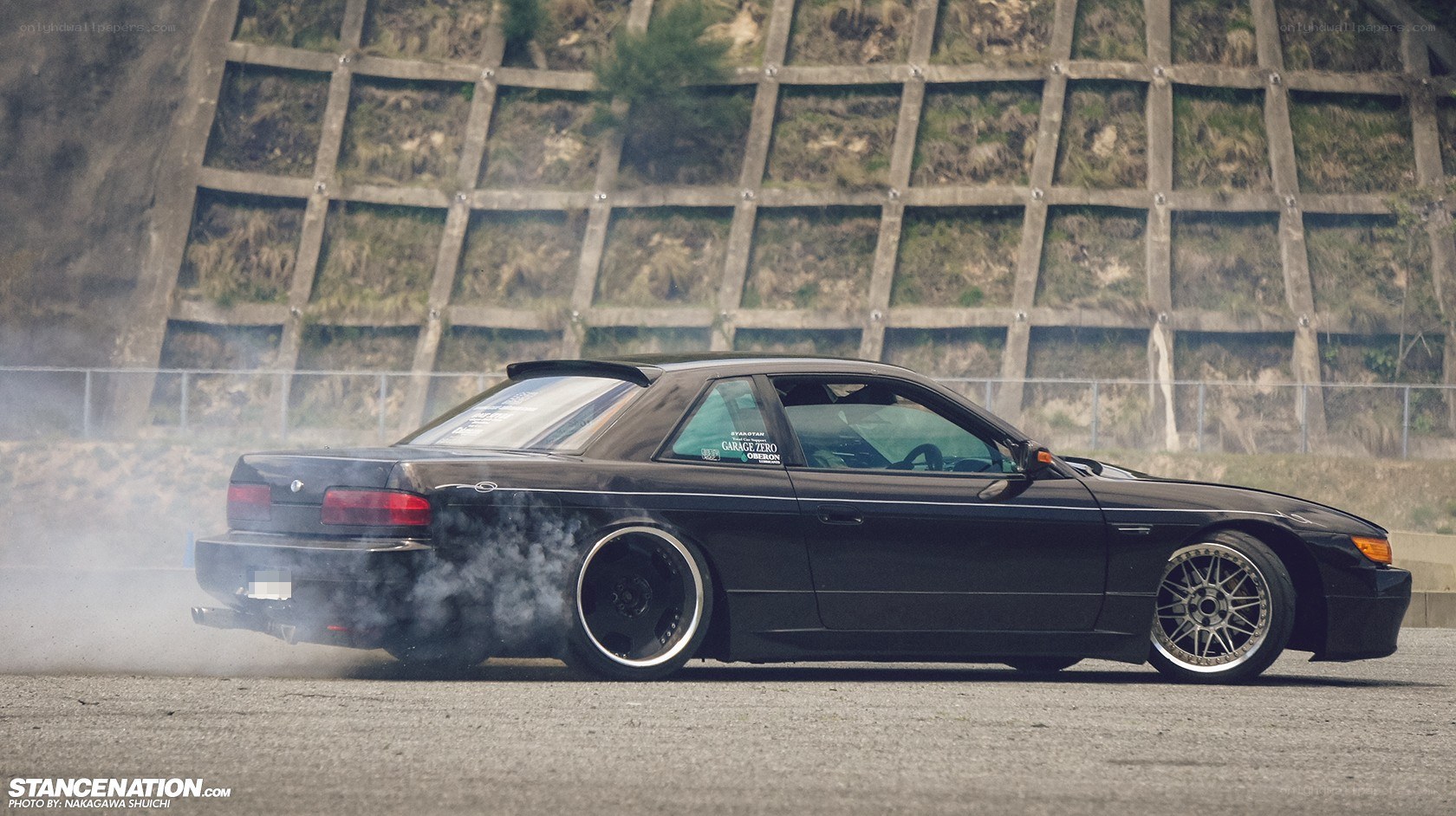 Black car drifting on track